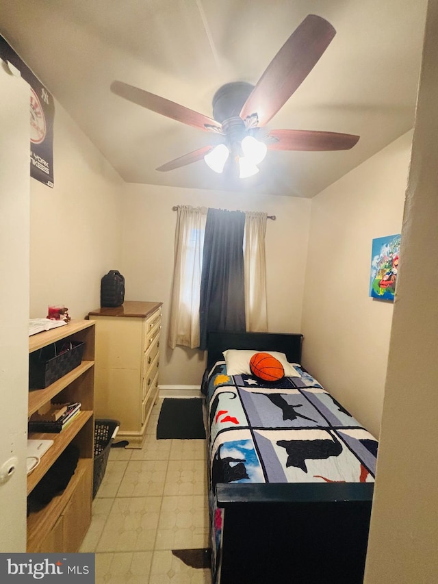 bedroom featuring ceiling fan and light floors