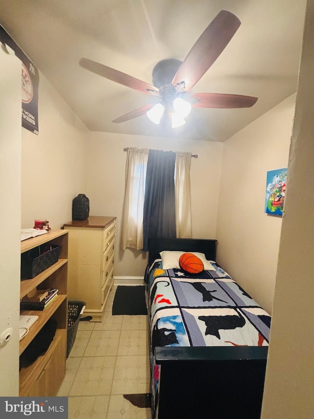 bedroom featuring light floors and a ceiling fan