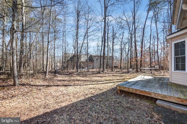 view of yard with a deck