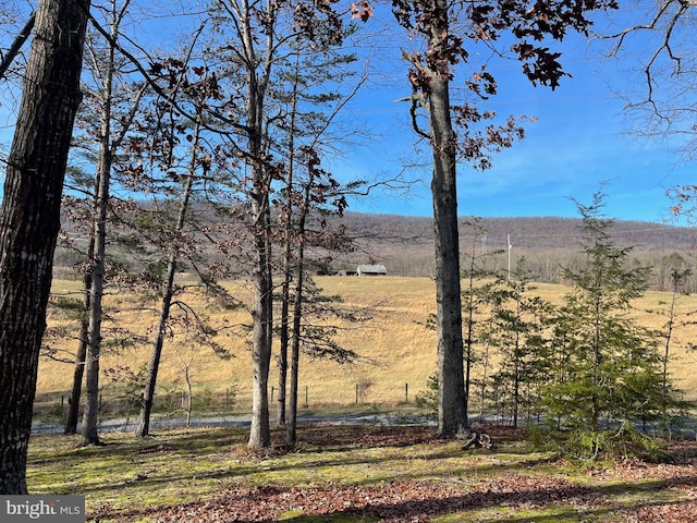 property view of mountains featuring a rural view