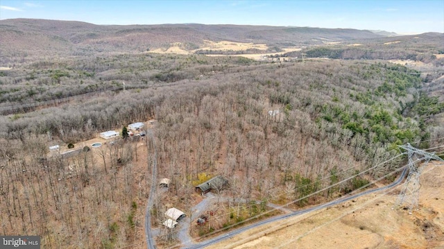 aerial view with a mountain view and a view of trees