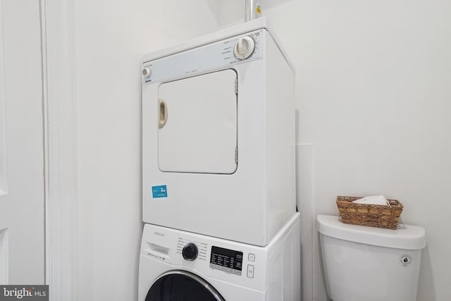 laundry room with laundry area and stacked washing maching and dryer