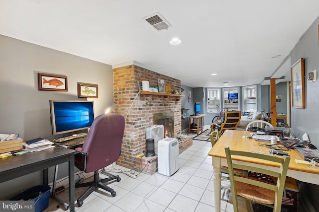 office with light tile patterned floors, visible vents, recessed lighting, and a fireplace