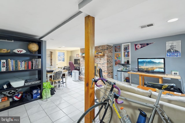 living room featuring tile patterned flooring and visible vents