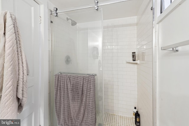 full bath with a shower stall