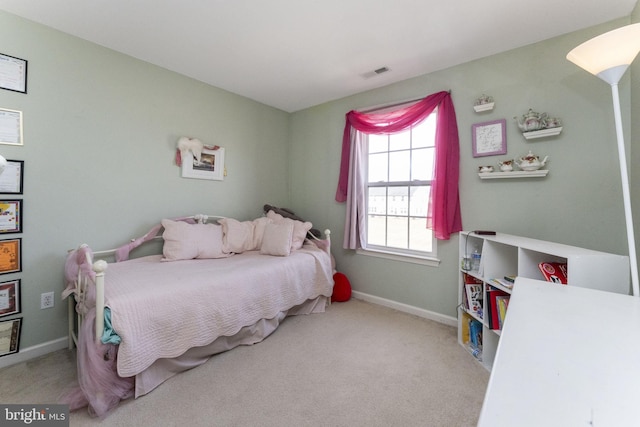 bedroom with carpet floors, visible vents, and baseboards