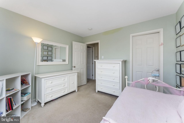 bedroom featuring light colored carpet