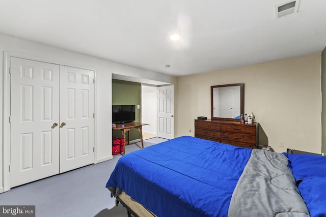 bedroom with a closet and visible vents