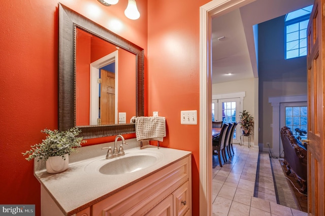 bathroom featuring tile patterned flooring and vanity