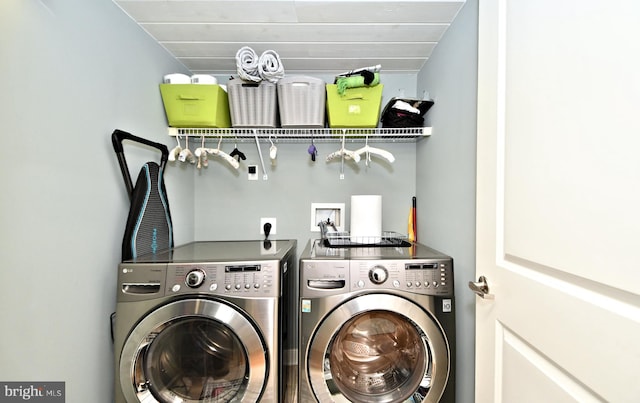 laundry area with laundry area and independent washer and dryer