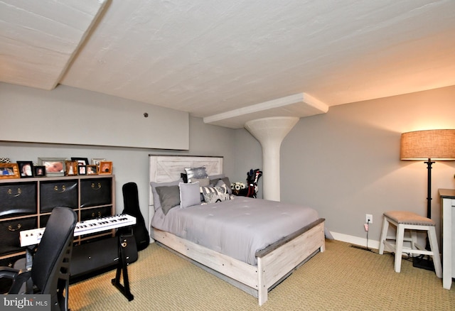 bedroom featuring carpet floors and baseboards