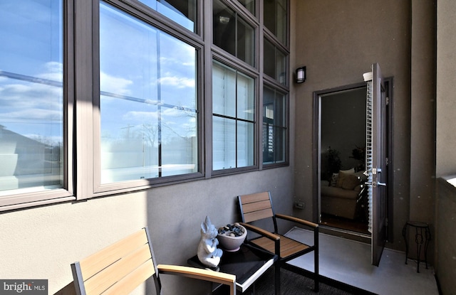 interior space featuring concrete flooring and a wealth of natural light