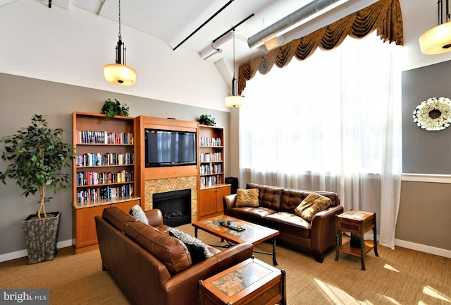 living room with light carpet, a fireplace, and baseboards