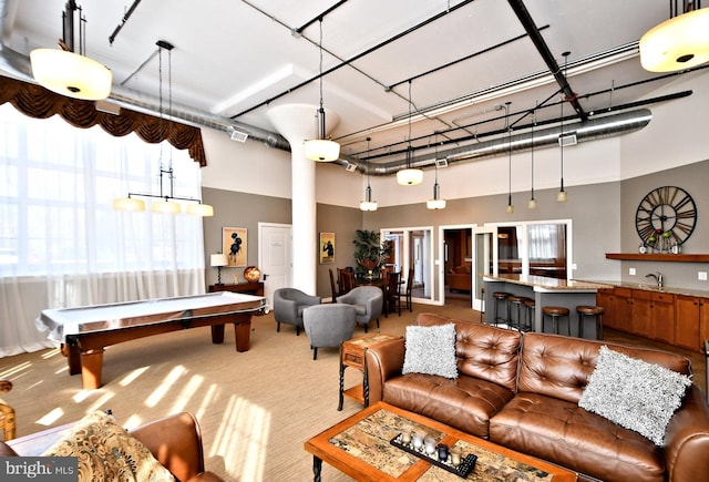 recreation room with pool table, carpet flooring, and a towering ceiling