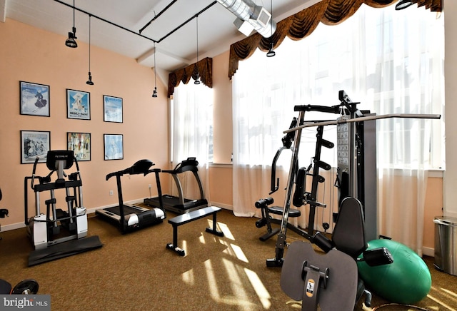 exercise room with baseboards