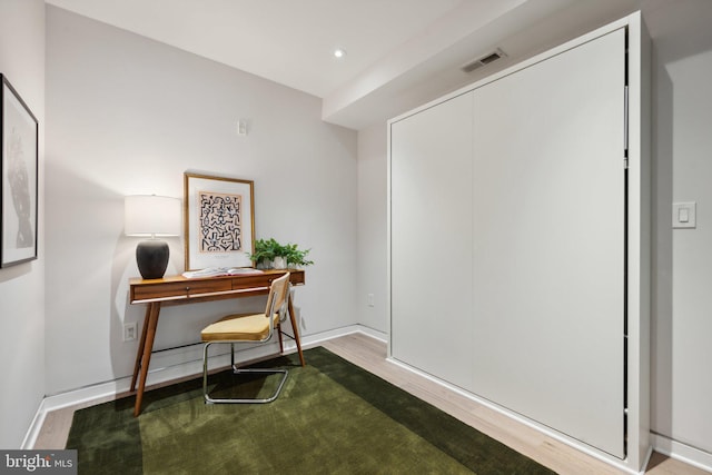 office area with recessed lighting, visible vents, baseboards, and wood finished floors