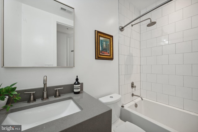 bathroom featuring toilet, washtub / shower combination, vanity, and visible vents