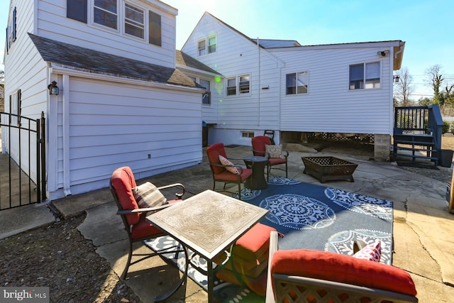 view of patio with an outdoor fire pit