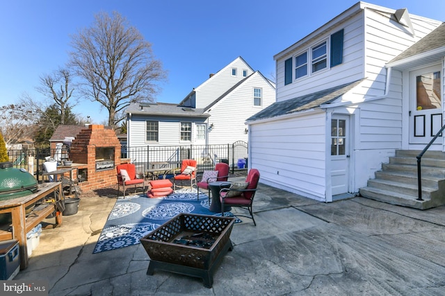 view of patio featuring a fireplace