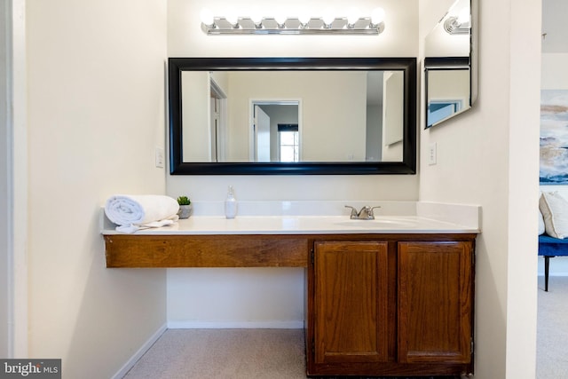 bathroom featuring vanity and baseboards