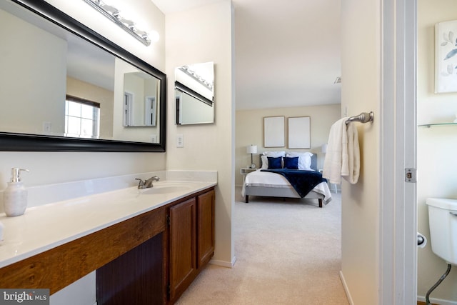 bathroom featuring vanity and baseboards