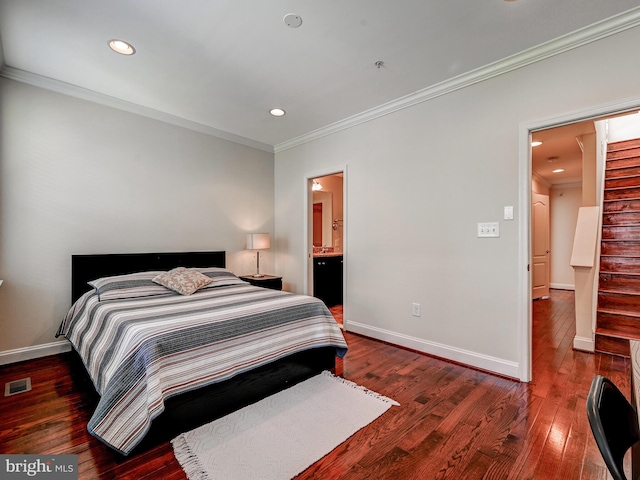 bedroom with baseboards, visible vents, crown molding, and hardwood / wood-style floors