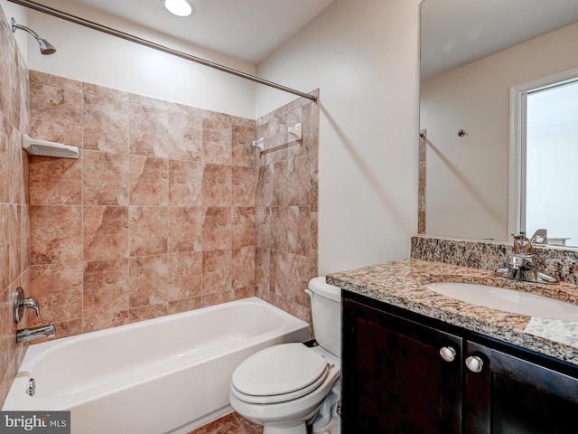 bathroom featuring toilet, shower / tub combination, and vanity