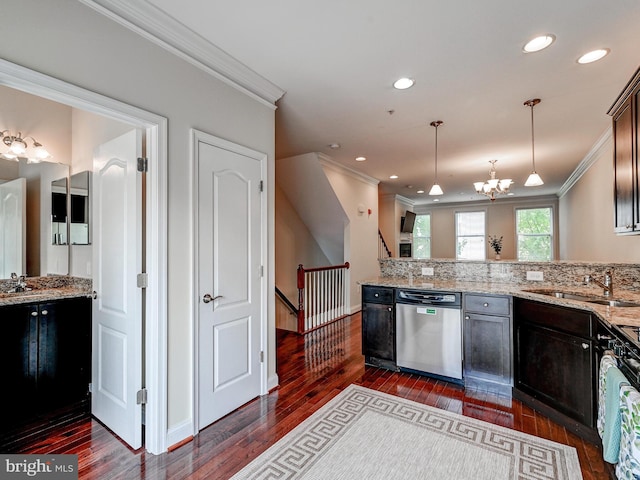 kitchen featuring dishwasher, a sink, and crown molding