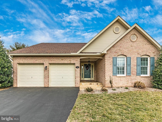 ranch-style home with a garage, driveway, a shingled roof, and brick siding