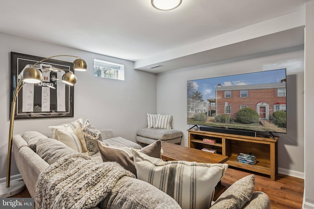 interior space with visible vents, baseboards, and wood finished floors