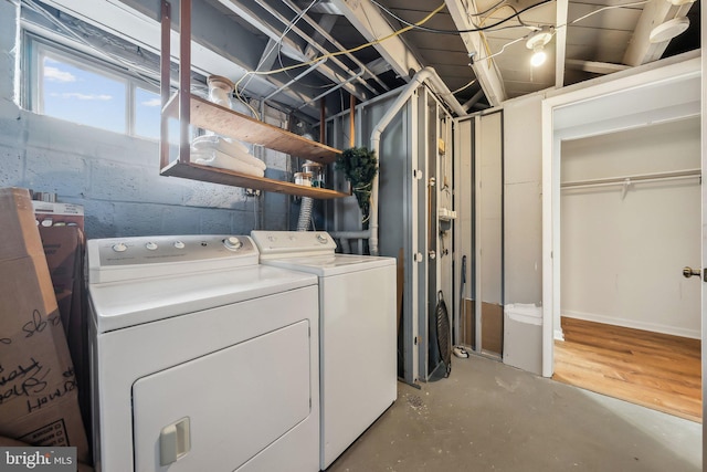 clothes washing area with washer and dryer