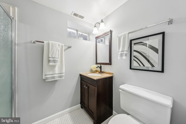 bathroom with baseboards, visible vents, vanity, and toilet