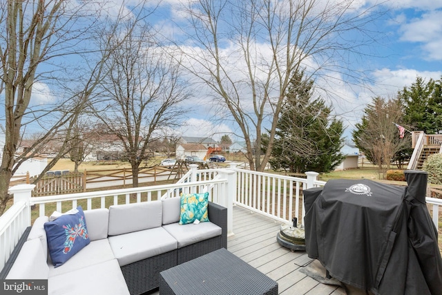 deck with grilling area and outdoor lounge area