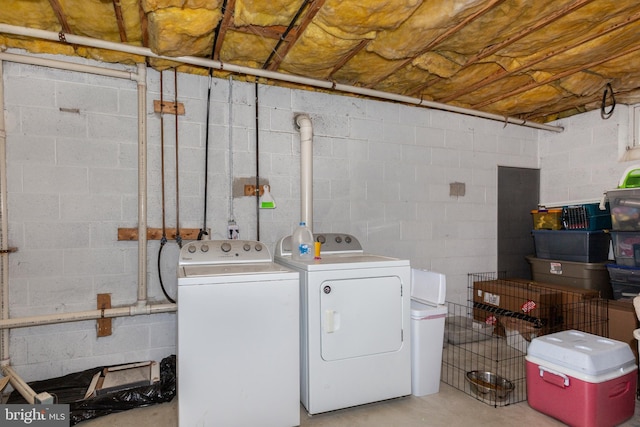 washroom with laundry area and washer and dryer