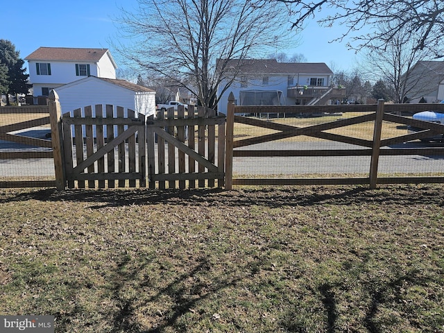 view of gate with fence