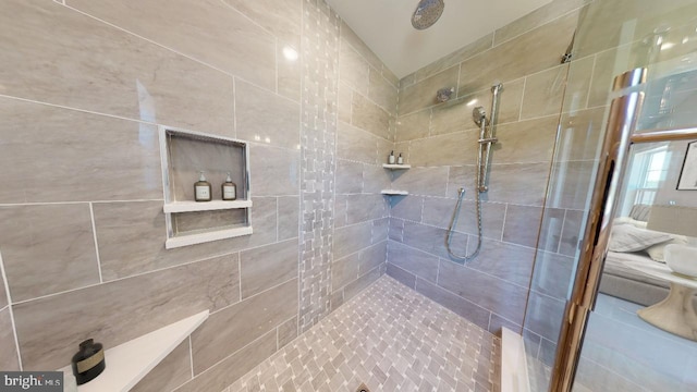 bathroom featuring a tile shower