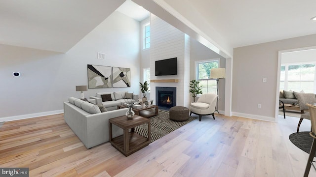 living room featuring a wealth of natural light and light wood-style floors