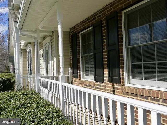 view of property exterior with a porch