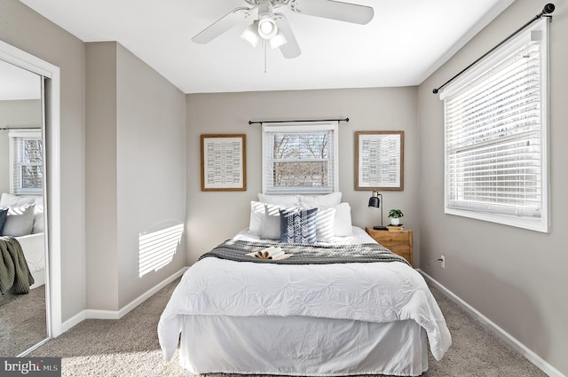 bedroom with carpet floors, baseboards, and a ceiling fan