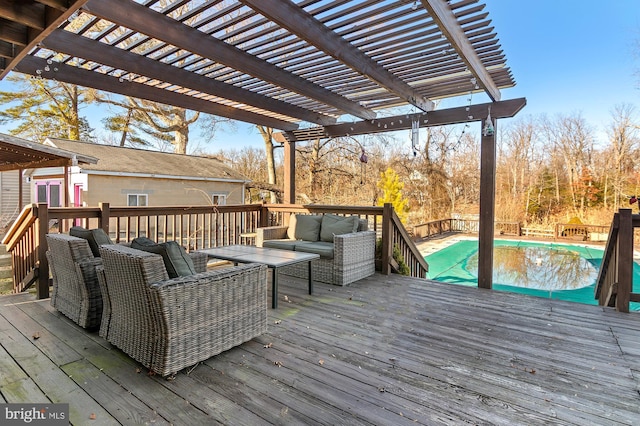 wooden deck featuring a fenced in pool, outdoor lounge area, and a pergola