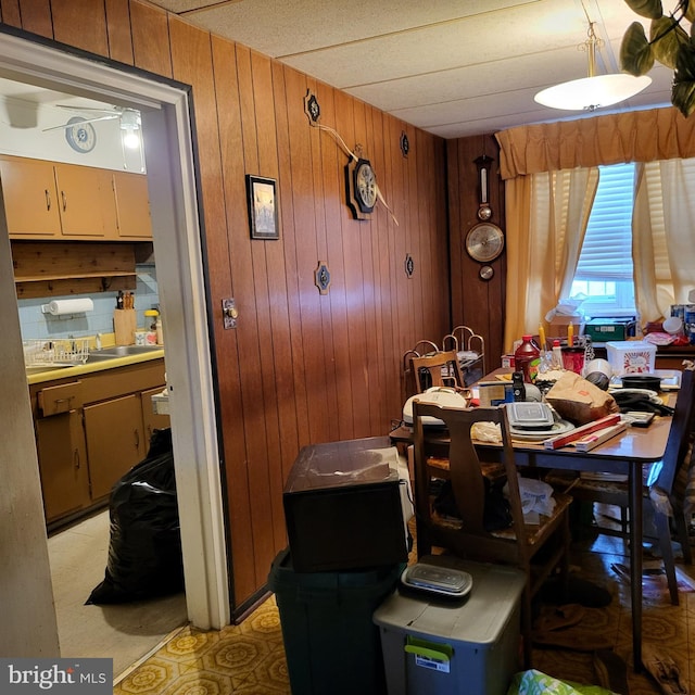 dining room with wooden walls