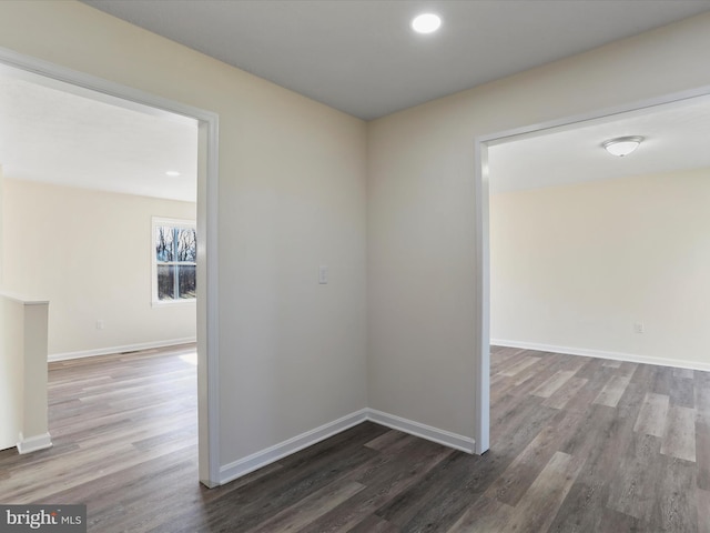 corridor featuring recessed lighting, baseboards, and wood finished floors