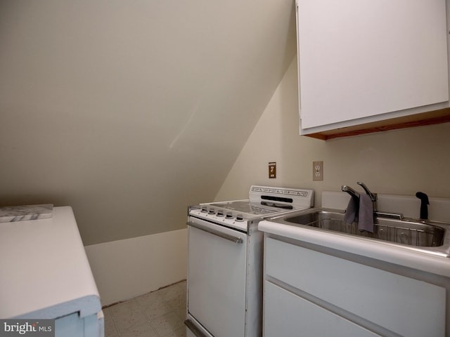 clothes washing area with a sink