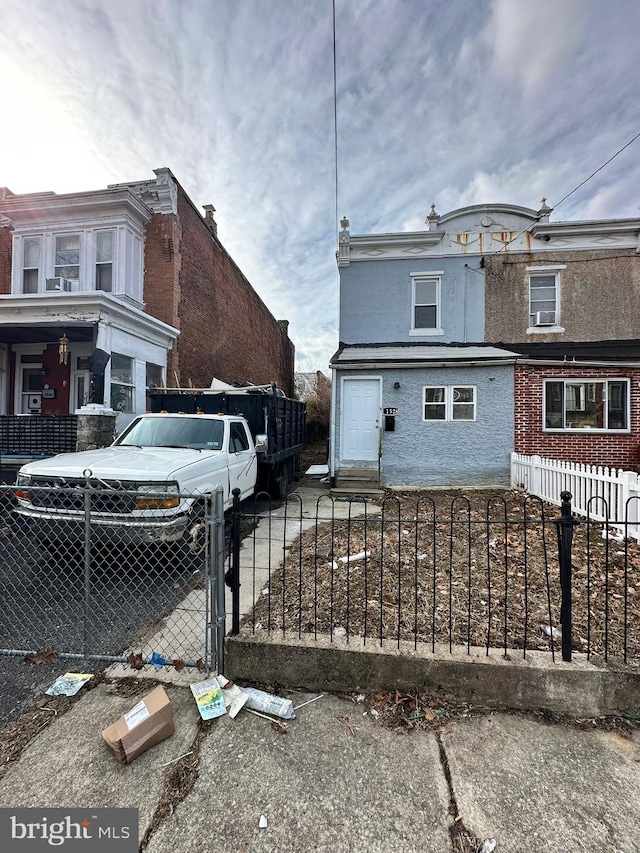 view of side of home with a fenced front yard