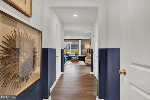 corridor featuring recessed lighting and dark wood finished floors