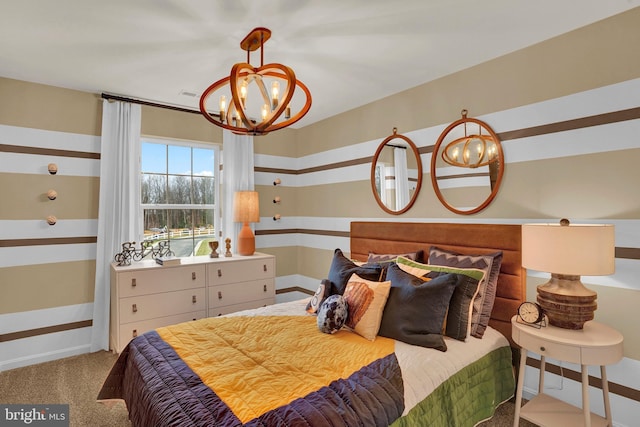 bedroom featuring a chandelier, light colored carpet, visible vents, and baseboards