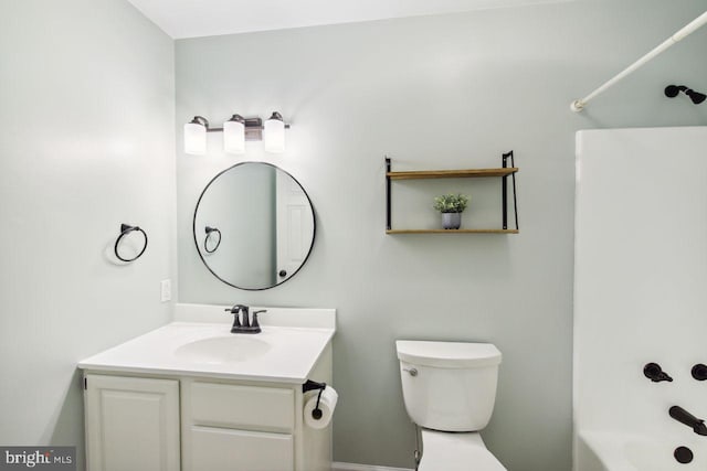 full bathroom with vanity, toilet, and shower / washtub combination