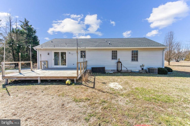 back of house featuring a wooden deck, a lawn, and cooling unit