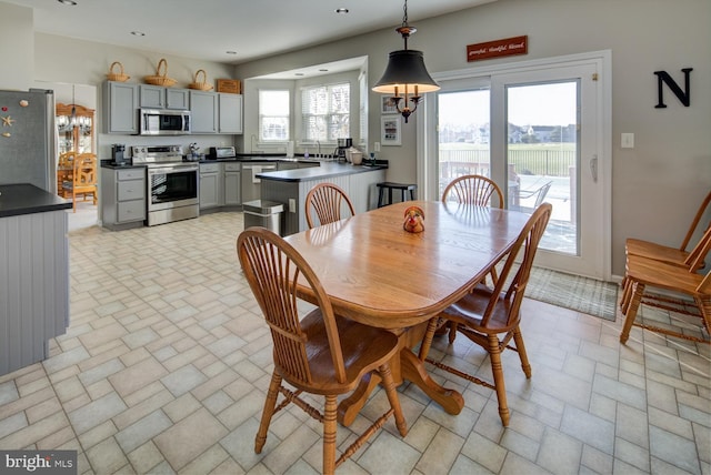 dining space featuring stone finish flooring