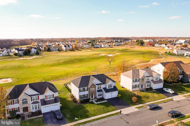 aerial view with view of golf course and a residential view